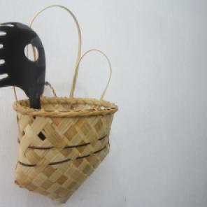 Revived Caddy - set of three. The basket design was taken from the old catalogue of the Nabua Home Industries Center and it was given a bit of a twist. The new ("kitchen") caddy now features an ear handle convenient for hanging the basket, and some simple striped designs using abaca (Manila hemp). Personally, I think this caddy would be useful in taming our unruly cables and other portables. ;) Materials: Banban (bamboo strips), Abaca (Manila Hemp), Uwoy (I don't know the English word for this yet but it's a local grass), glue, varnish